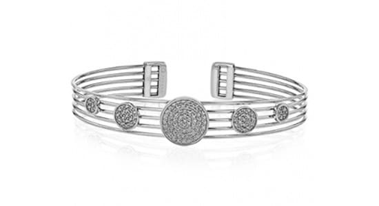a white gold cuff bracelet with diamond details