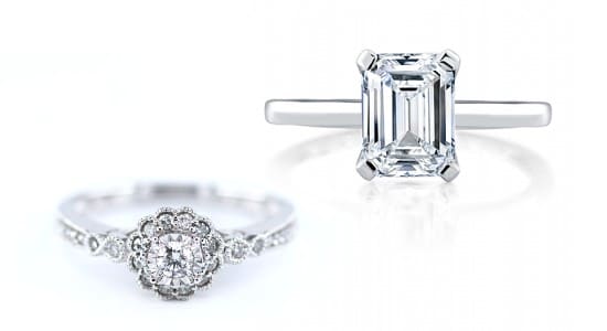 an elaborate, white gold halo engagement ring next to a white gold solitaire diamond ring with an emerald cut center stone