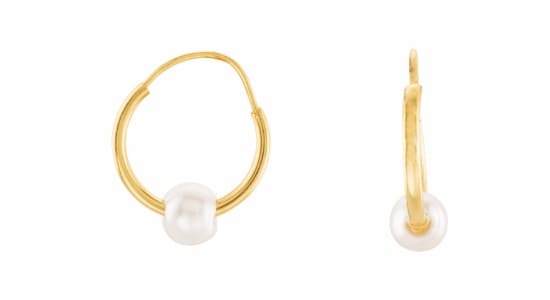 a pair of gold Stuller hoops with pearls threaded on them