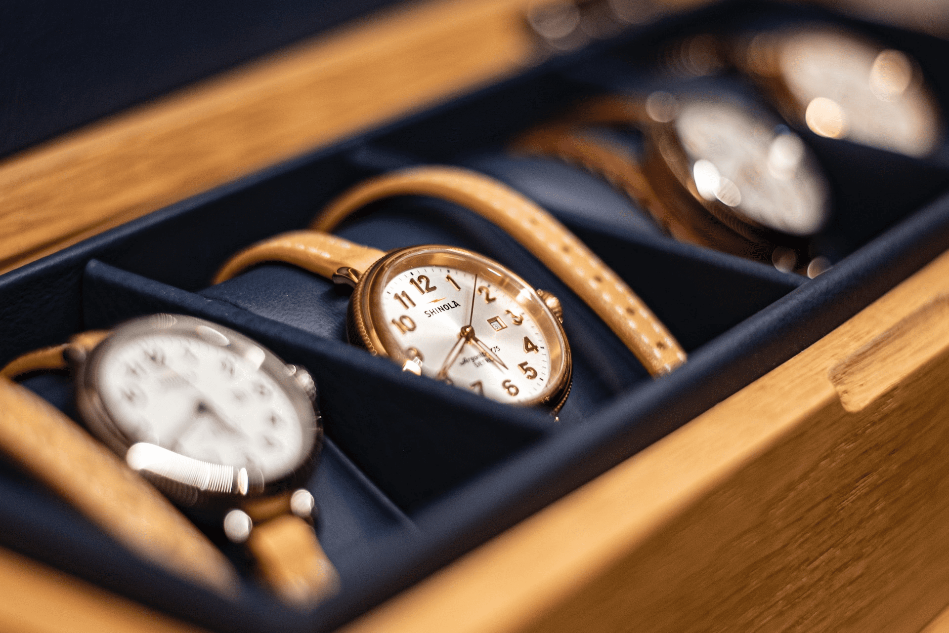 Shinola watches in a case waiting to be worn